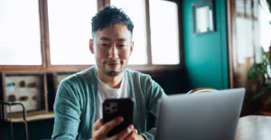 Man reviewing digital health solutions while sitting at a desk